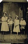 (AMERICAN TINTYPES) Group of 11 patriotic tintypes shot in different photographers studios, with images of children holding the
